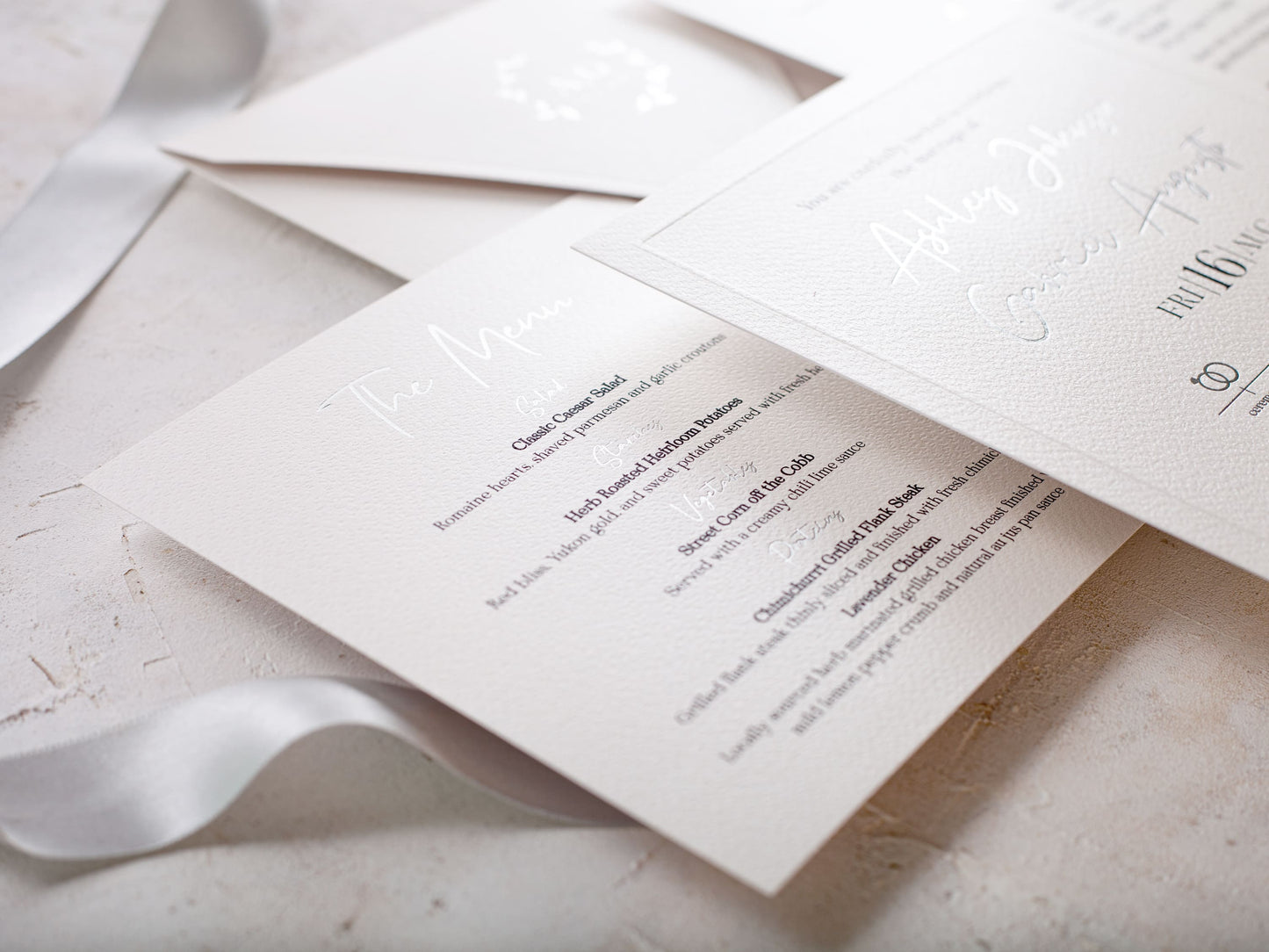 Pearl white wedding invitation with silver foil print
