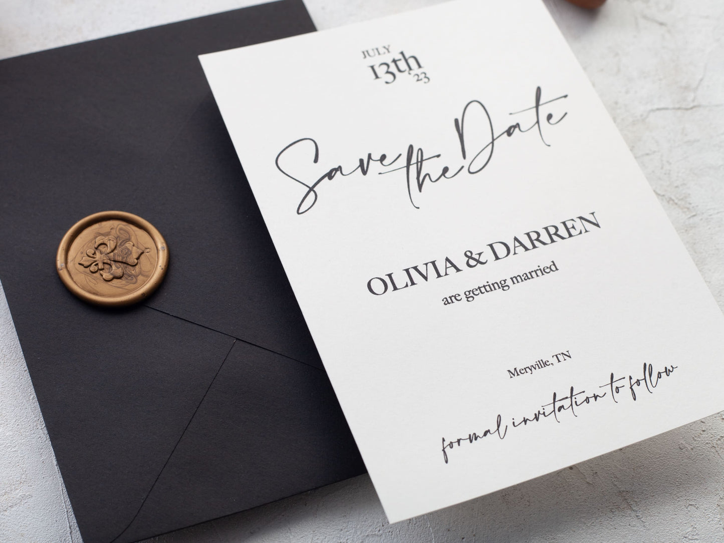 Black save the date cards with envelope and wax seal