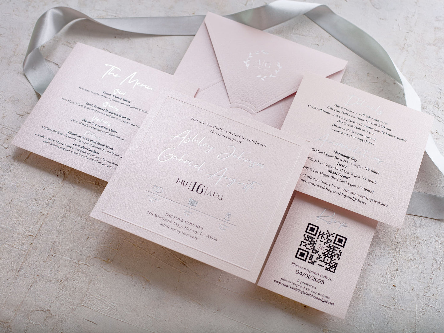 Blush pink wedding invitation with silver foil print