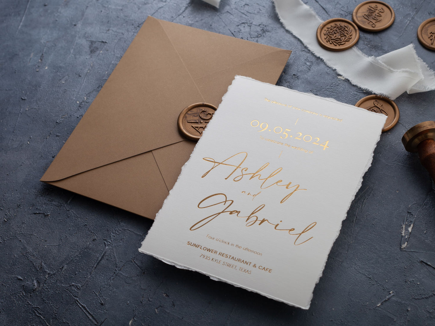 Deckled edge wedding invitation with gold foil details