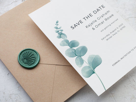 save the date card with eucalyptus leaf