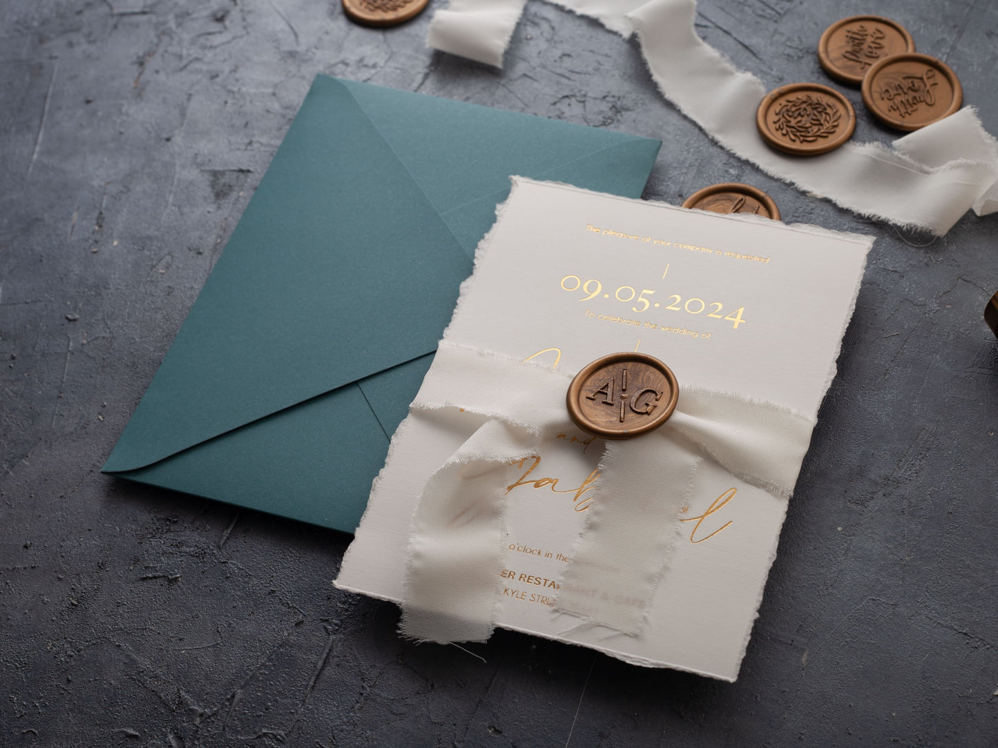 Gold foil printed deckled edge wedding invitation, wax seal and ribbon