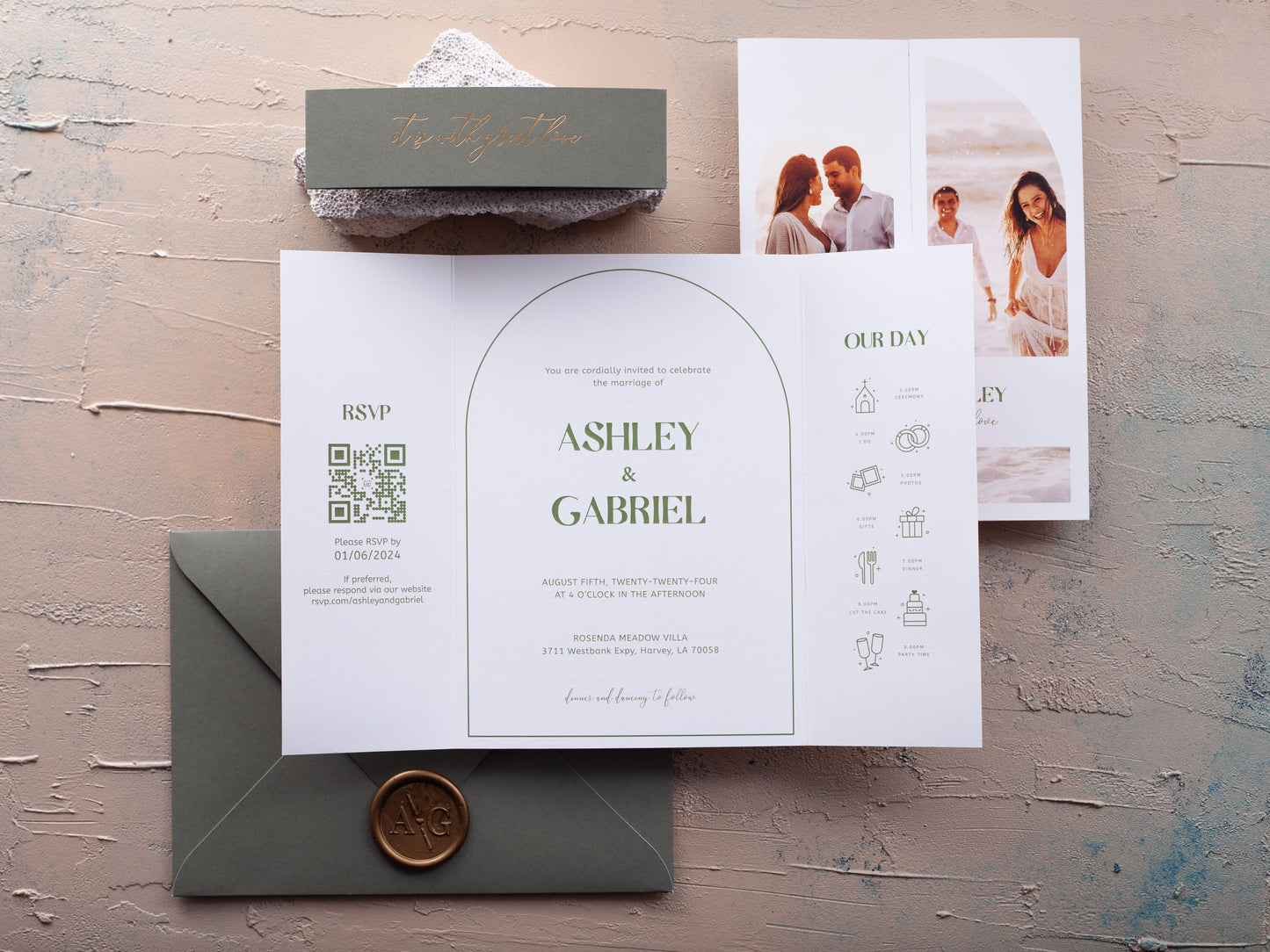 Folded photo wedding invitation, green belly band, green envelope and gold wax seal
