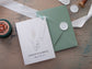 Simple wedding invite with sage green envelope