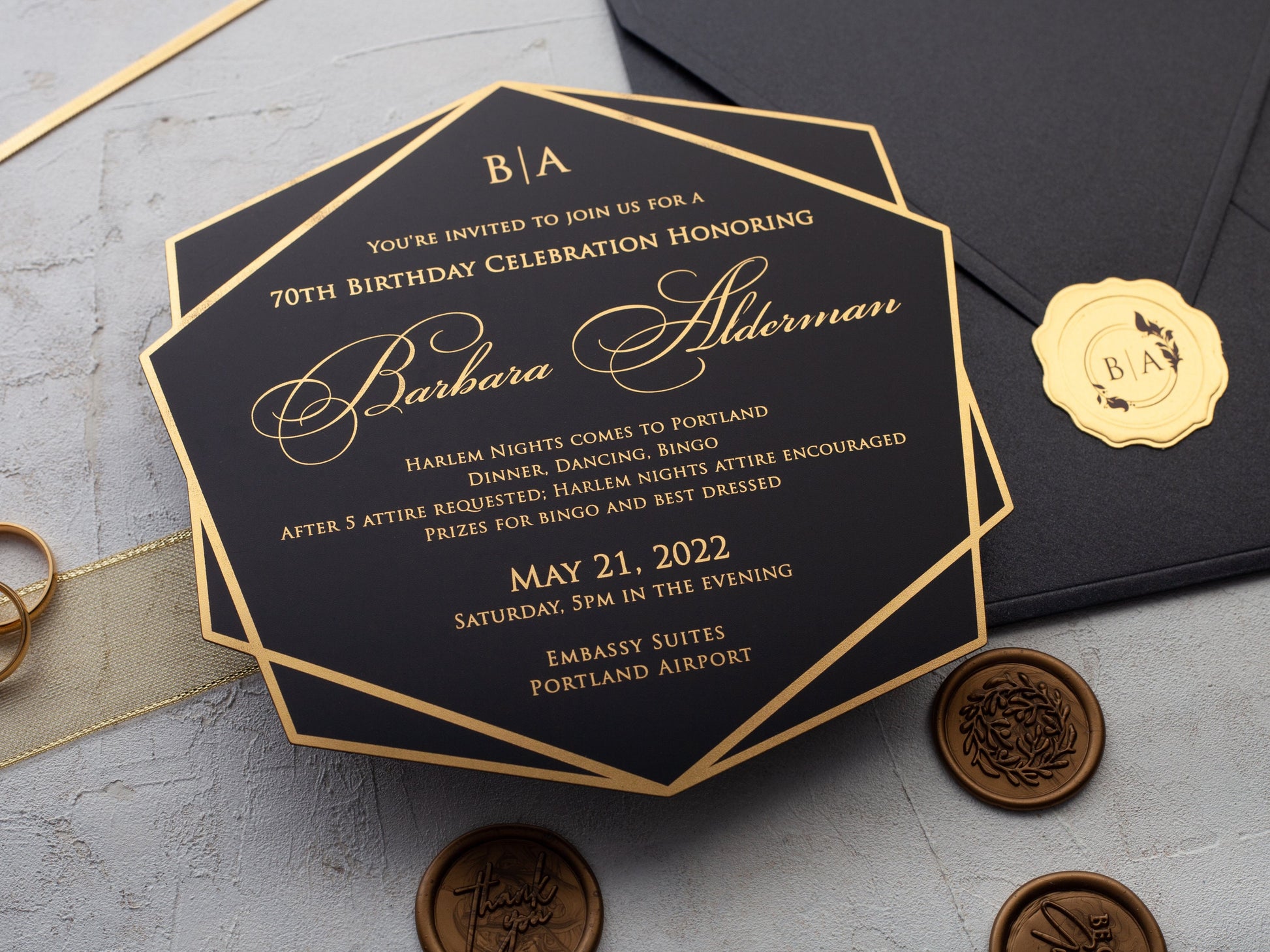 Gold foil printed celebration invitation with black envelope